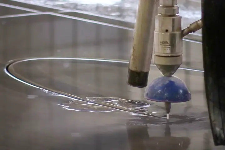 Robo SawJet waterjet cutting a sink hole for stone fabrication